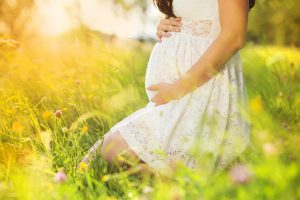 pregnant-woman-in-white-dress-in-natureR
